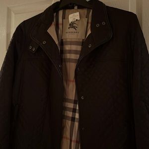 Women’s Burberry jacket black inside of the jacket is the Burberry plaid colors
